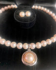 Our signature strand of 10-11mm white pearls with sterling bolt ring clasp