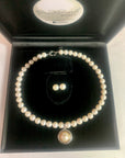 Our signature strand of 10-11mm white pearls with sterling bolt ring clasp