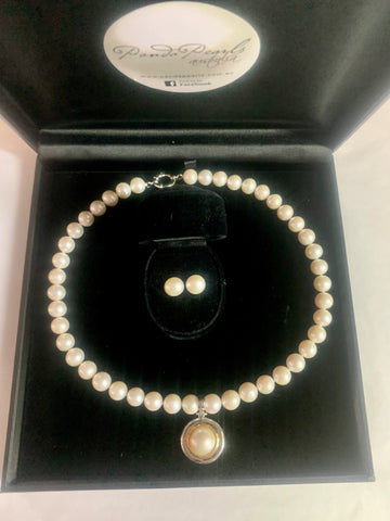 Our signature strand of 10-11mm white pearls with  sterling bolt ring clasp and Australian South Sea mabe pearl enhancer